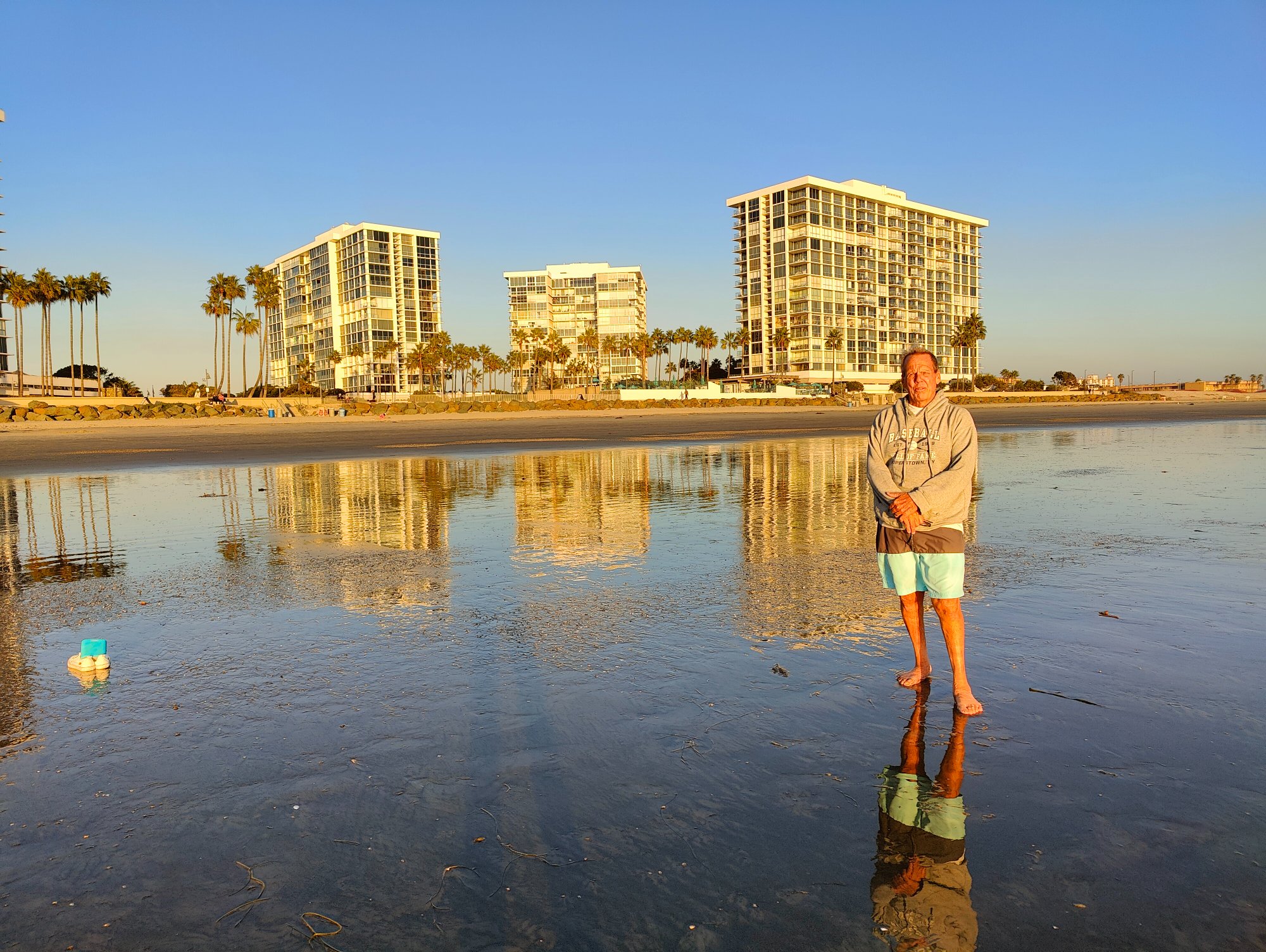 Michael Salois on Coronado Beach with the Coronado Shores towers in the background